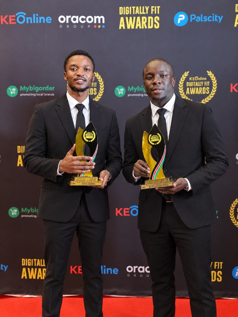 Samuel Kidemi and David Esabwa with Top Digitally Fit Web Design Firm of the Year trophies